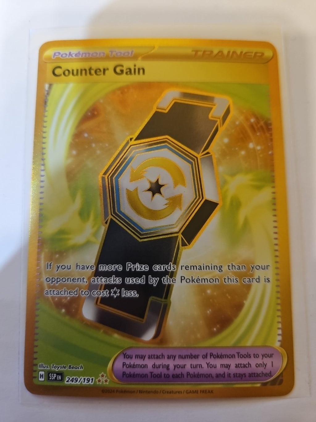 Pokemon - Surging Sparks - Counter Gain - 249/191 - Gold Secret Rare - Anime Card Craze
